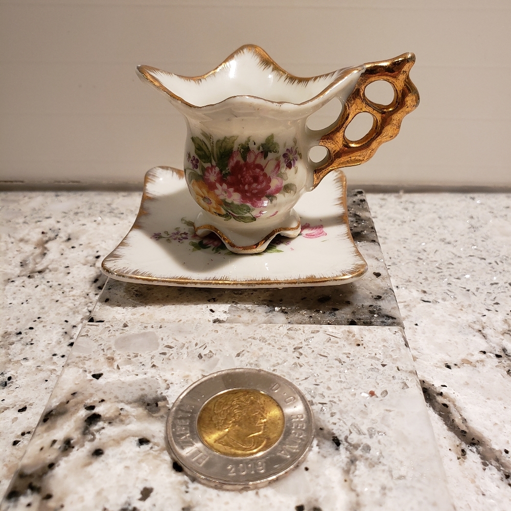 Miniature Enesco cup and saucer made in Japan after 1953.